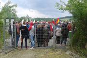 Visitors in front of the entrance to the “Bergkristall” tunnel system (Mauthausen Memorial)